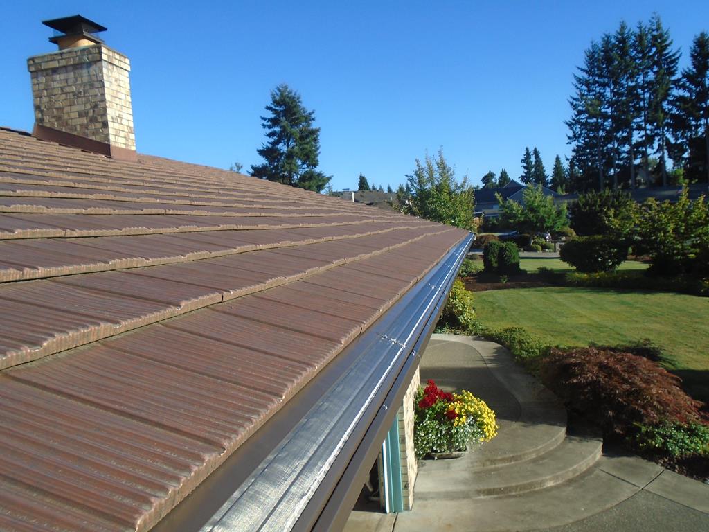 Gutter and gutter guard installation for Seattle homes. Protect your roof with precision installs and clog-free systems built for local weather